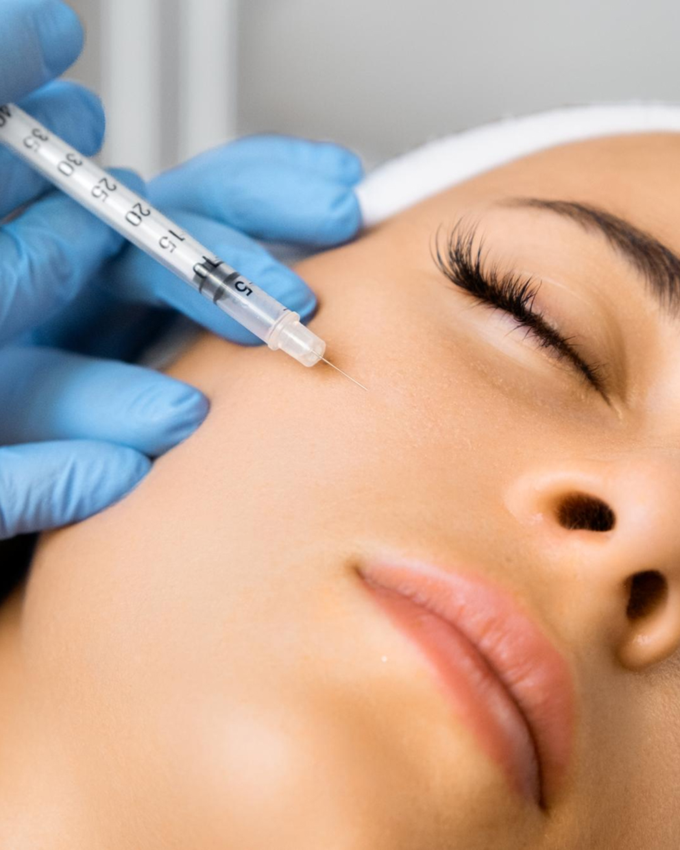Multi-nutrient skin booster being injected into the cheek